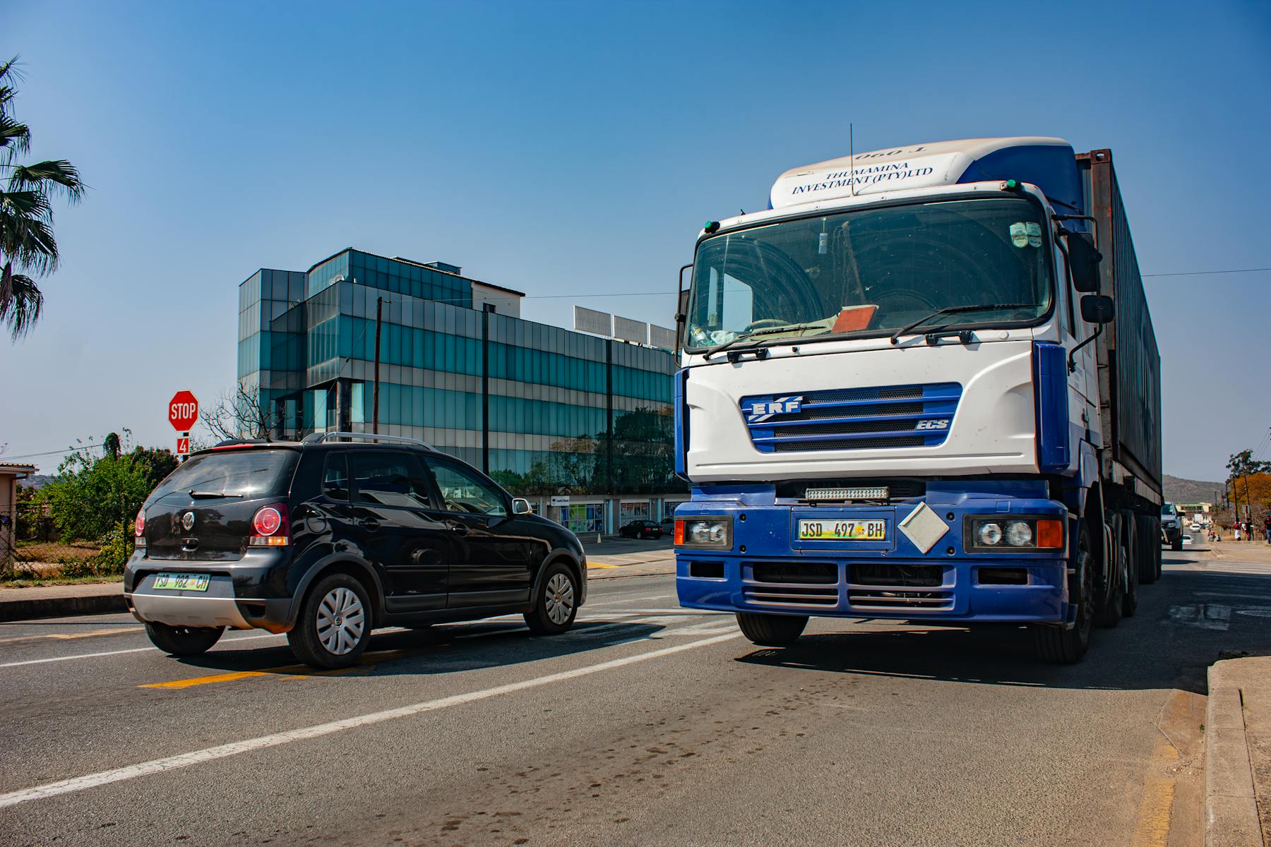 Cargo truck moving through city logistics corridor