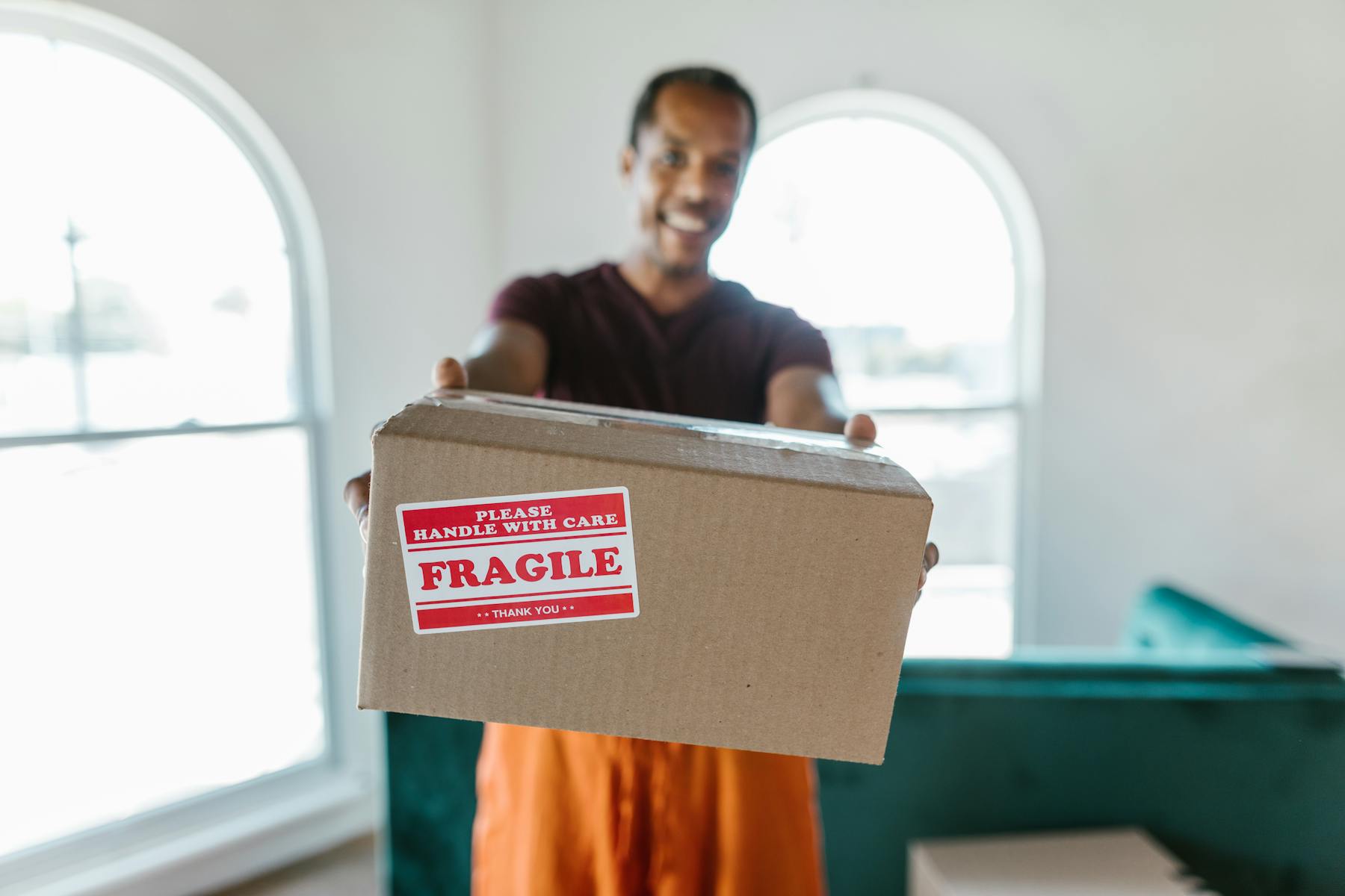 Mover carrying fragile cartons during move