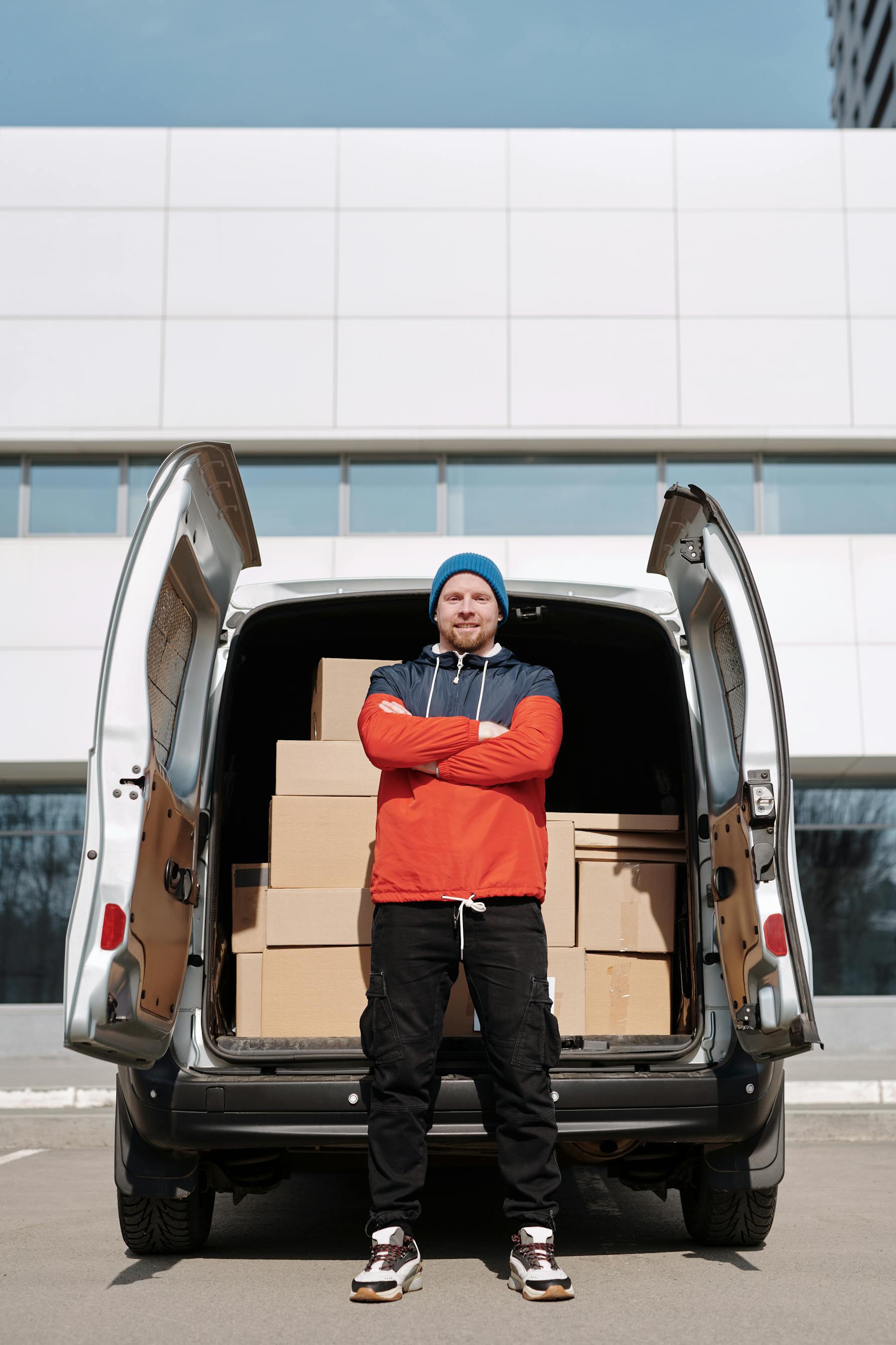 Team loading bulk order cartons into a van