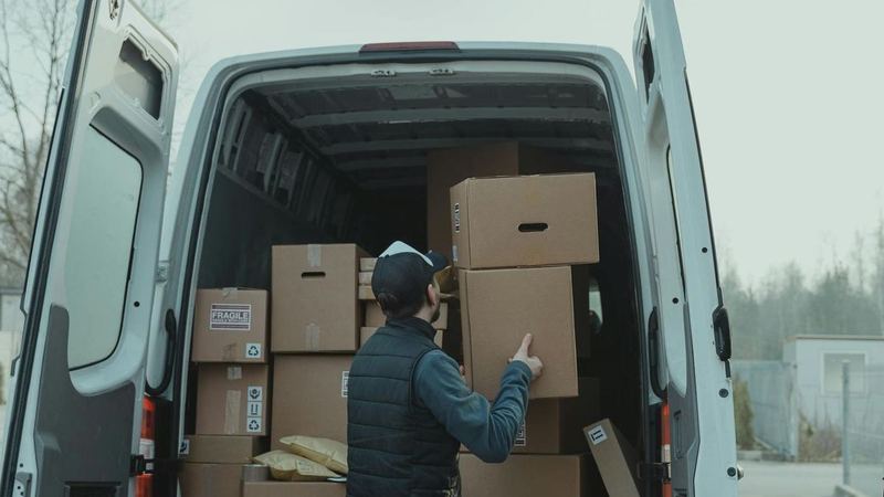 Mover carrying boxes for a residential move