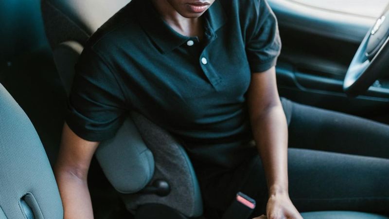 Black woman move driver checking route in a car