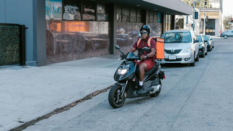 A dispatch rider on a city street