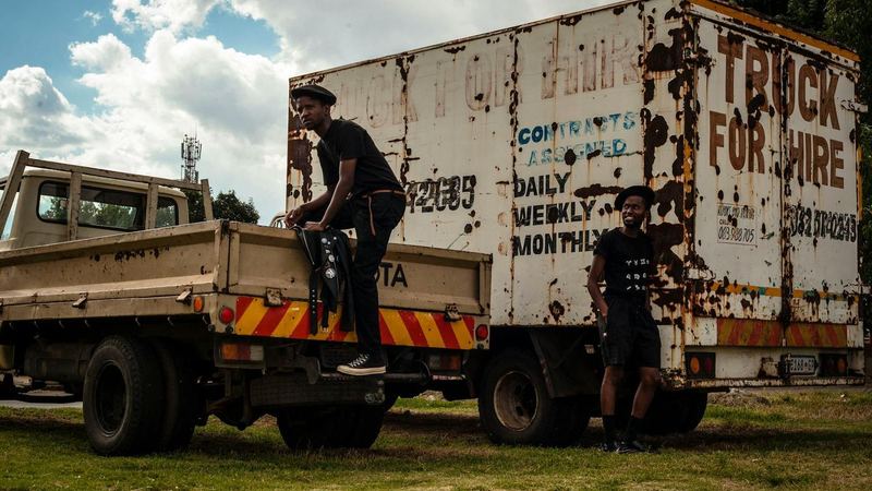 Black logistics workers with freight transport in Africa