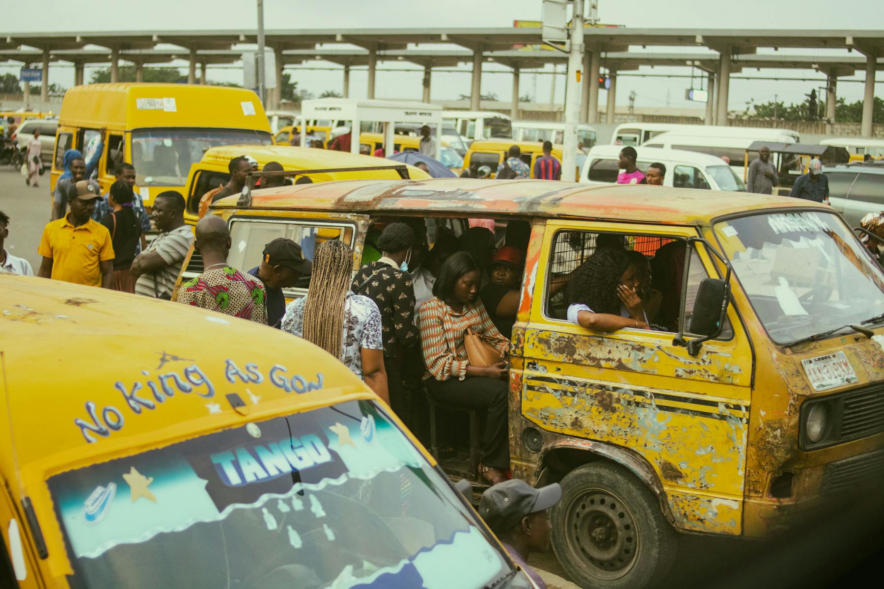 Lagos urban transport scene with high-density buses and private vehicles
