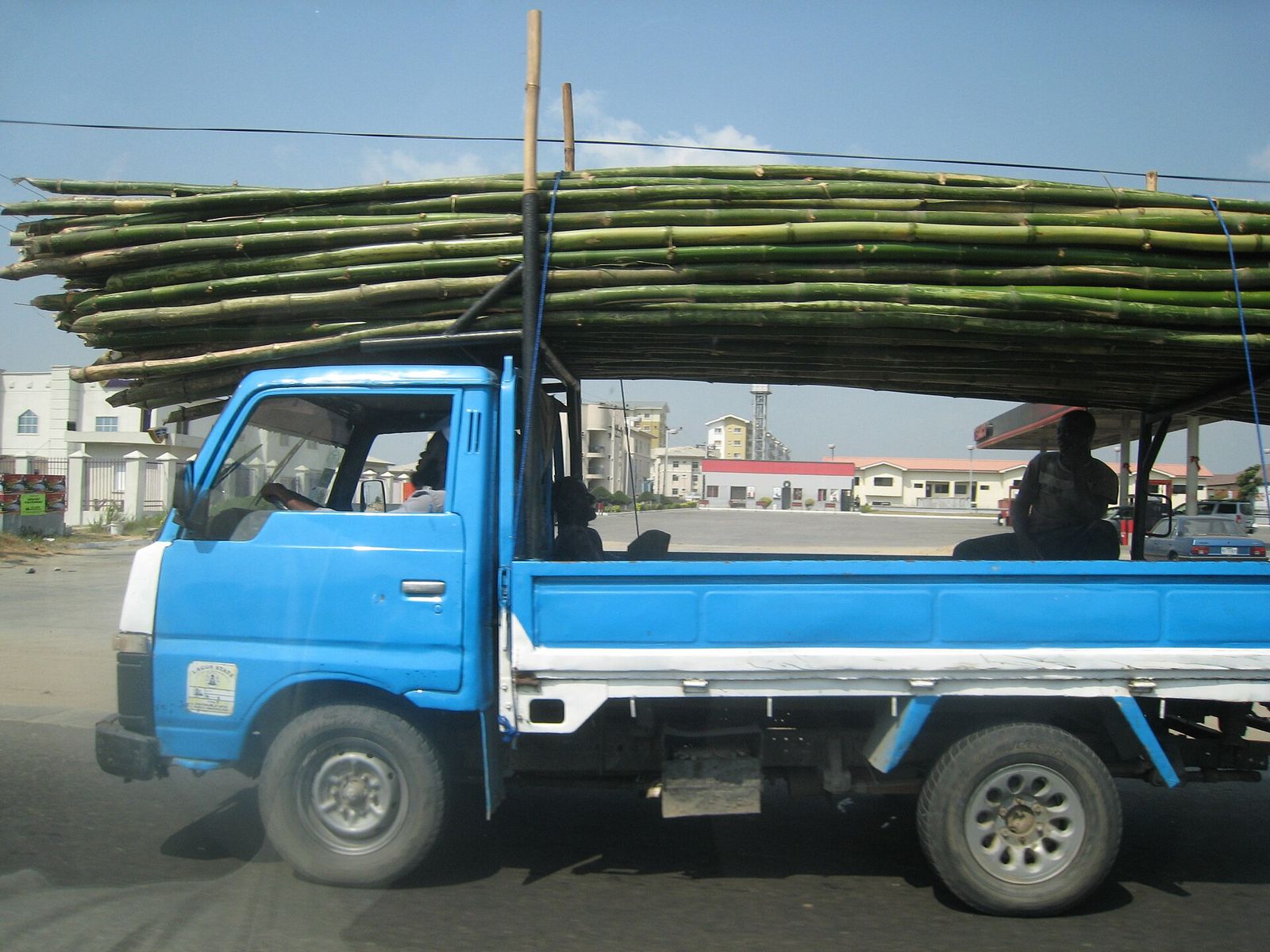 A light truck carrying a long load in Lagos