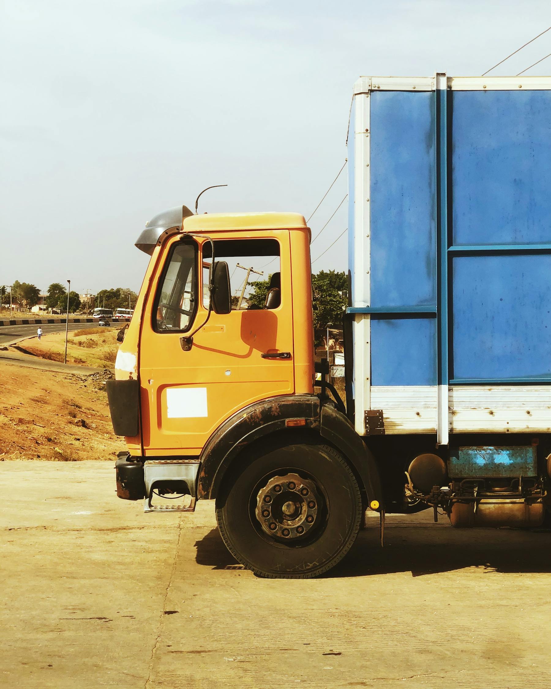 Long-haul truck carrying heavy cargo on Nigerian road