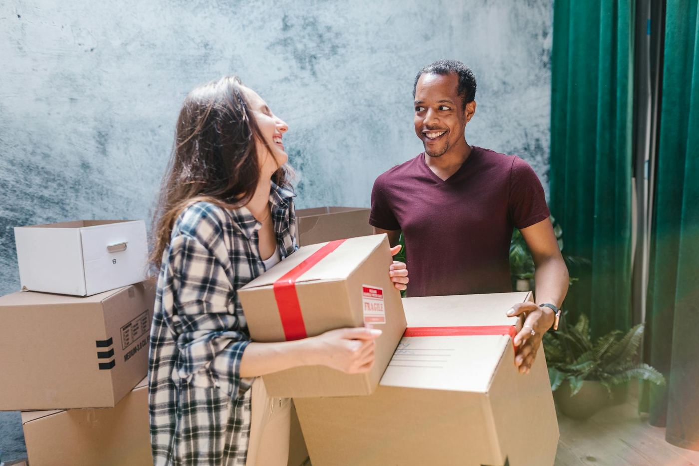 Two people packing boxes